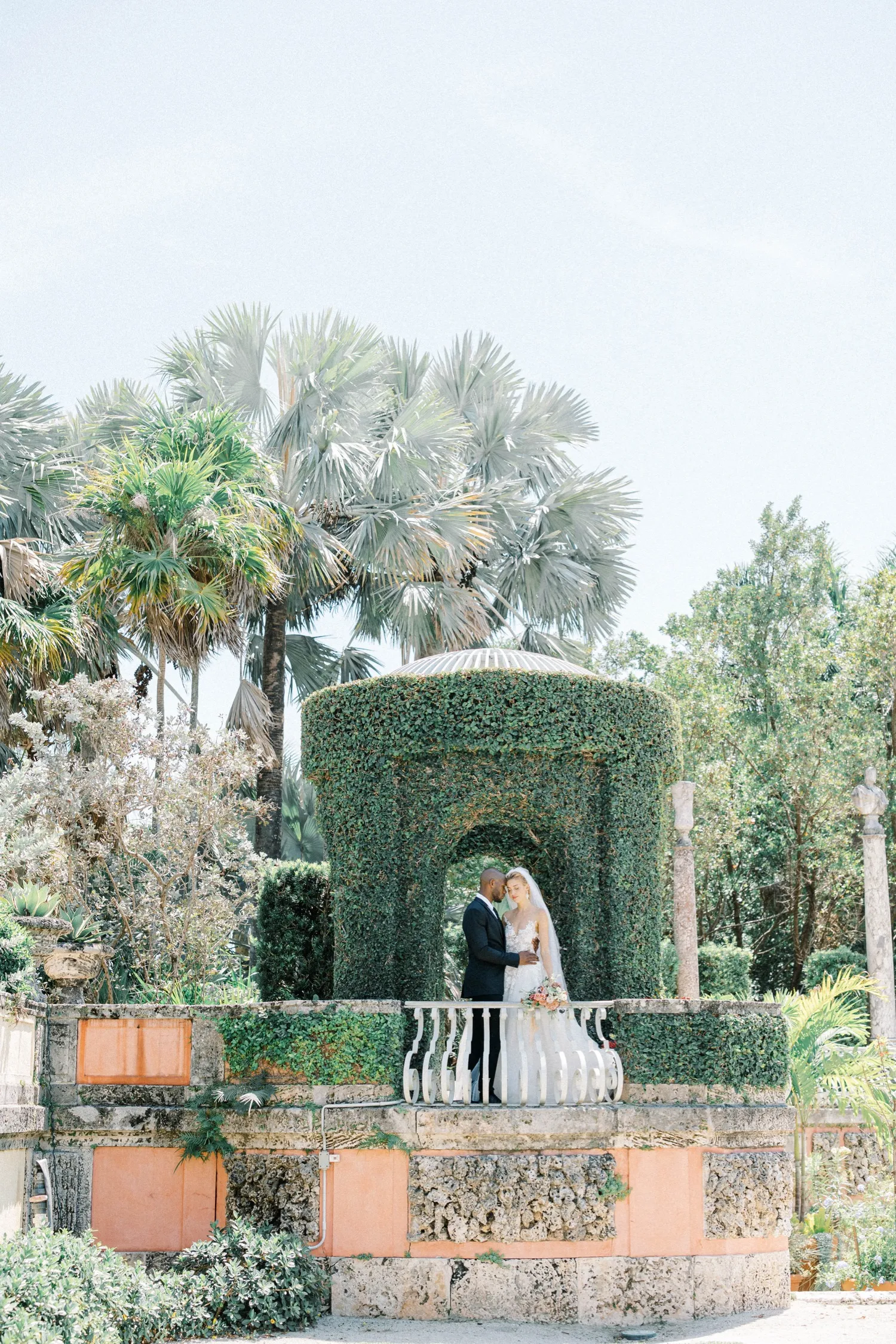 Wedding portraits on Vizcaya stone barge terrace by the bay
